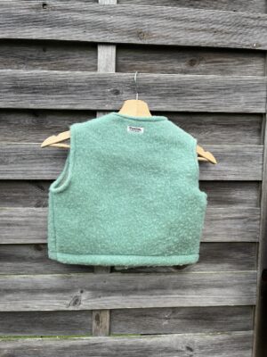 Le gilet enfant en laine bleu-vert